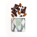 54% bittersweet chocolate almond bar styled with roasted almonds