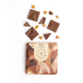 Close up of smooth milk chocolate with crunchy toffee bits
