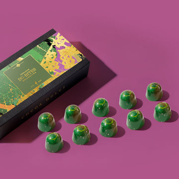 Dubai chocolate bites box with individual pistachio chocolates on a pink background